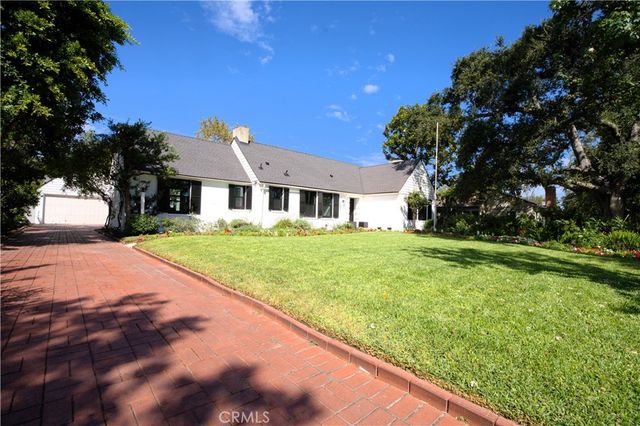 a view of house with yard