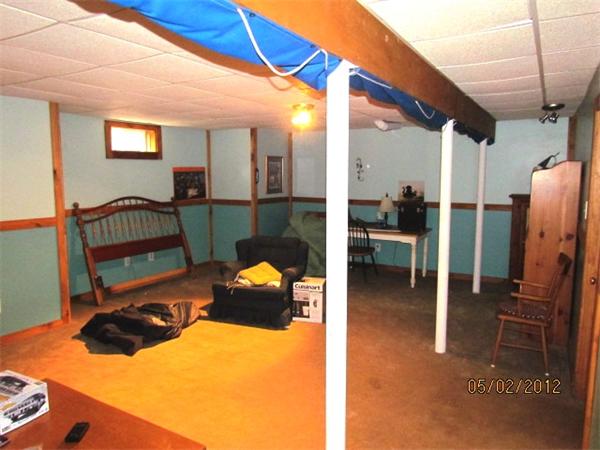 402 New Boston Road Sturbridge, MA 01566 - Photo 11 of 16 a view of a chairs and a room in the back
