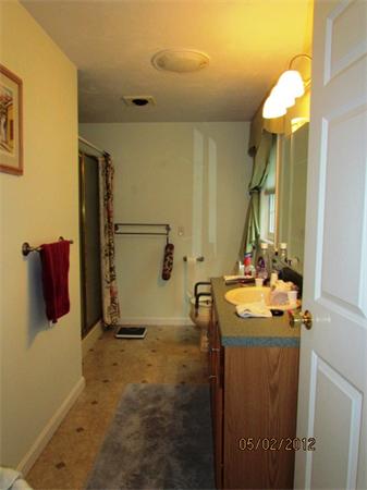 402 New Boston Road Sturbridge, MA 01566 - Photo 14 of 16 a bathroom with a sink and mirror