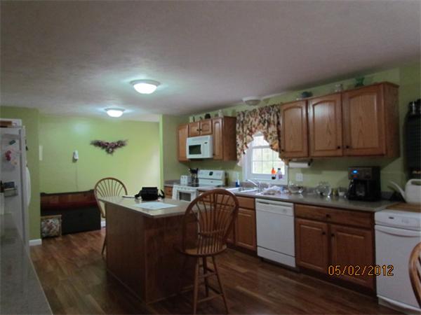 402 New Boston Road Sturbridge, MA 01566 - Photo 4 of 16 a kitchen with granite countertop a sink and cabinets