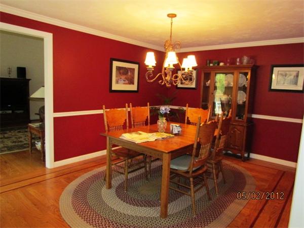 402 New Boston Road Sturbridge, MA 01566 - Photo 5 of 16 a dining room with furniture a chandelier and wooden floor
