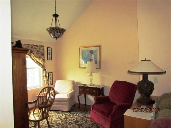 402 New Boston Road Sturbridge, MA 01566 - Photo 7 of 16 a view of a livingroom with furniture and a chandelier