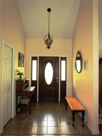 402 New Boston Road Sturbridge, MA 01566 - Photo 9 of 16 a living room with a table chair and a chandelier