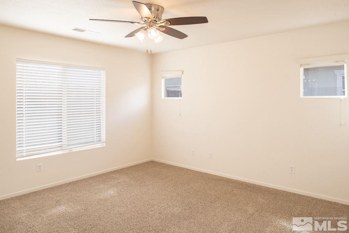 7764 Tulear Street Reno, NV 89506 - Photo 7 of 21 a view of an empty room with a window