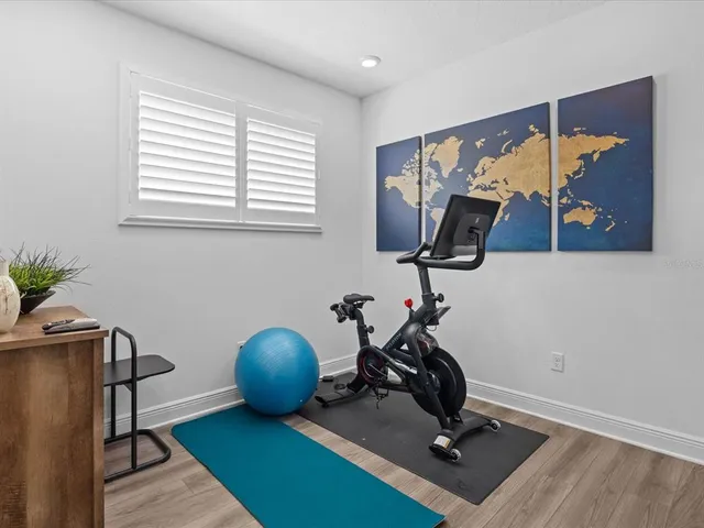 a bedroom with a bed dresser and a window