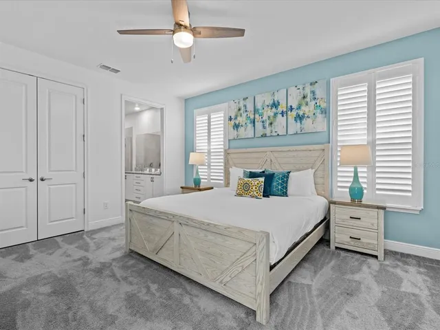 a view of a patio with table and chairs and potted plants