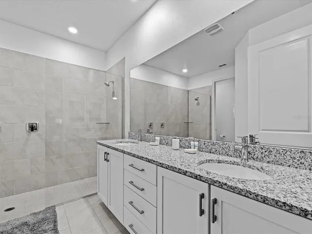 a bathroom with a sink and mirror