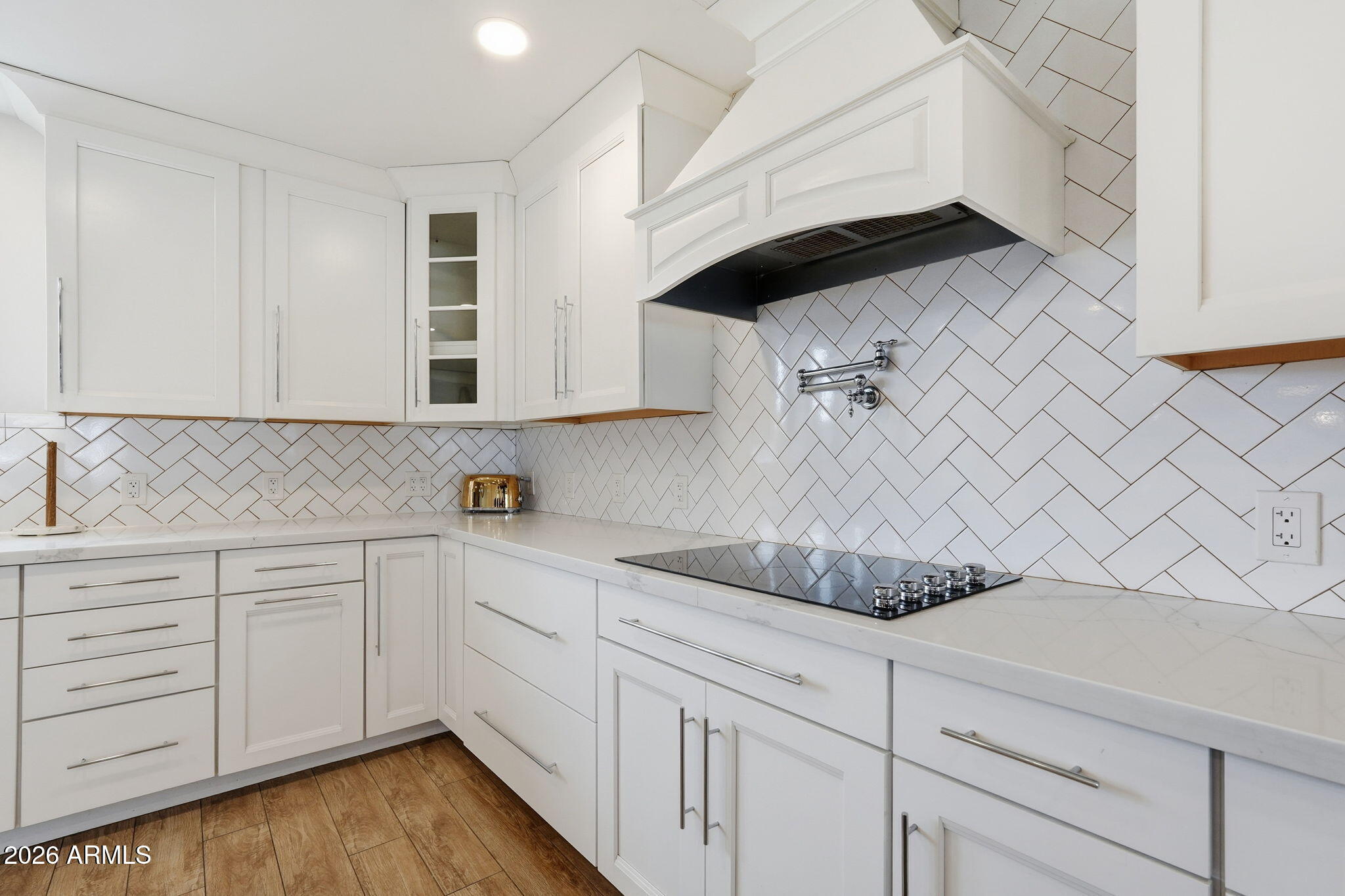 2858 East Redfield Road Gilbert, AZ 85234 - Photo 26 of 60 a kitchen with white cabinets and sink