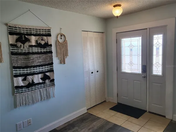 a kitchen with a stove sink and cabinets