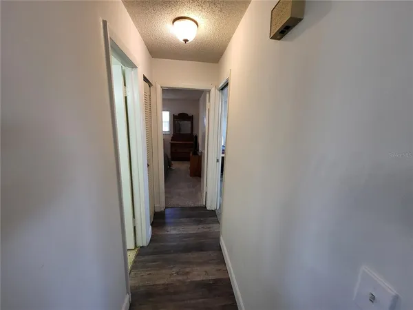 a bedroom with a bed and a mirror