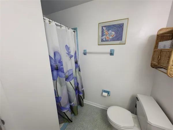 a bedroom with a bed chair and window