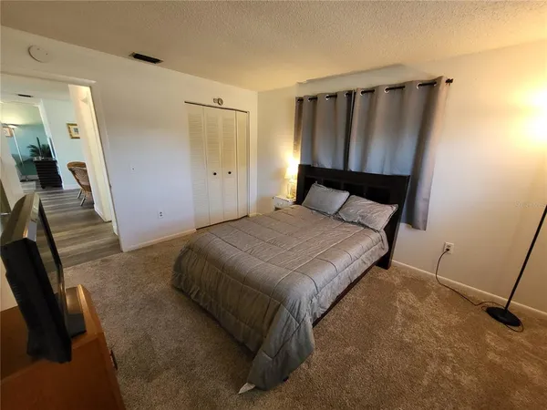 a bedroom with a bed and furniture