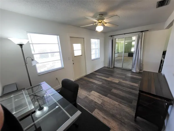 a view of an empty room with a fireplace