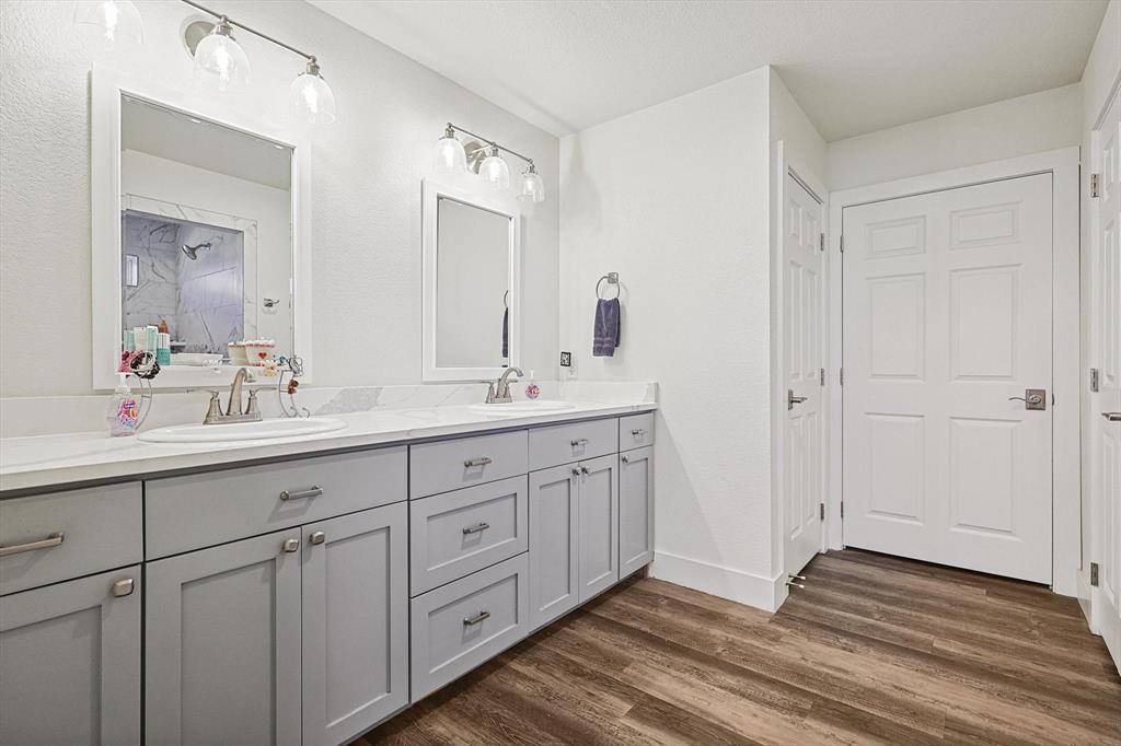 1161 Lynn Creek Road Jacksboro, TX 76458 - Photo 14 of 40 Bathroom featuring vanity and wood-type flooring