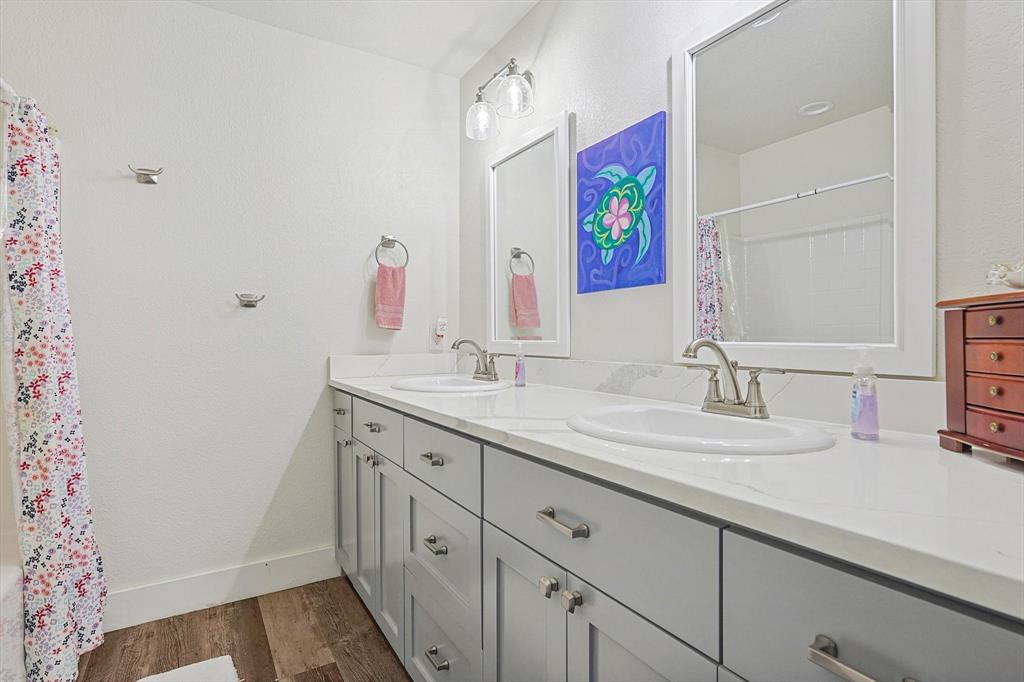 1161 Lynn Creek Road Jacksboro, TX 76458 - Photo 23 of 40 Bathroom with wood-type flooring and vanity