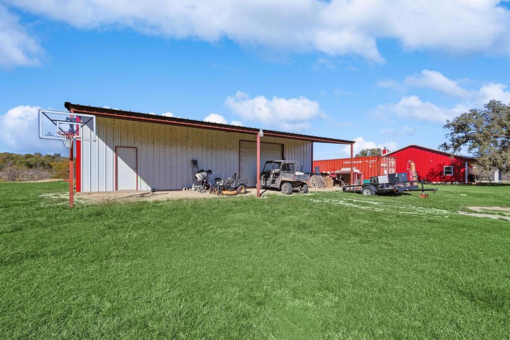 1161 Lynn Creek Road Jacksboro, TX 76458 - Photo 27 of 40 View of outdoor structure with a lawn