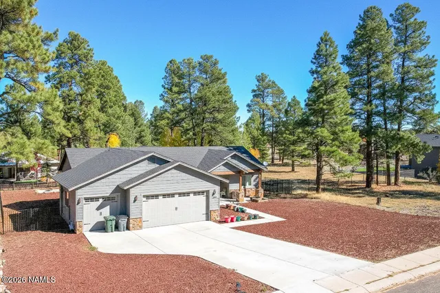 a living room with fireplace furniture and a flat screen tv
