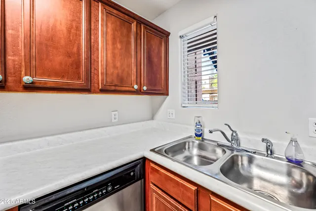 a kitchen with stainless steel appliances granite countertop a stove a refrigerator and a microwave oven