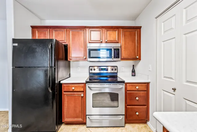 a kitchen with a stove and a microwave