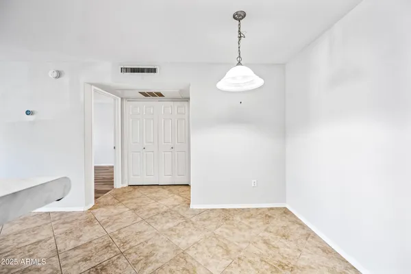 a spacious bathroom with a toilet a sink and a window