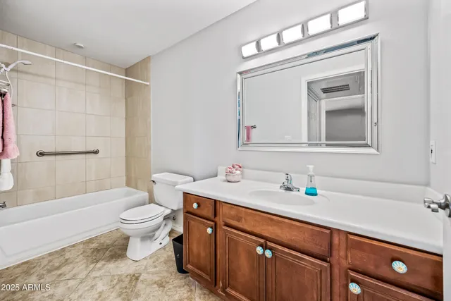 a view of a storage and utility room with washer and dryer