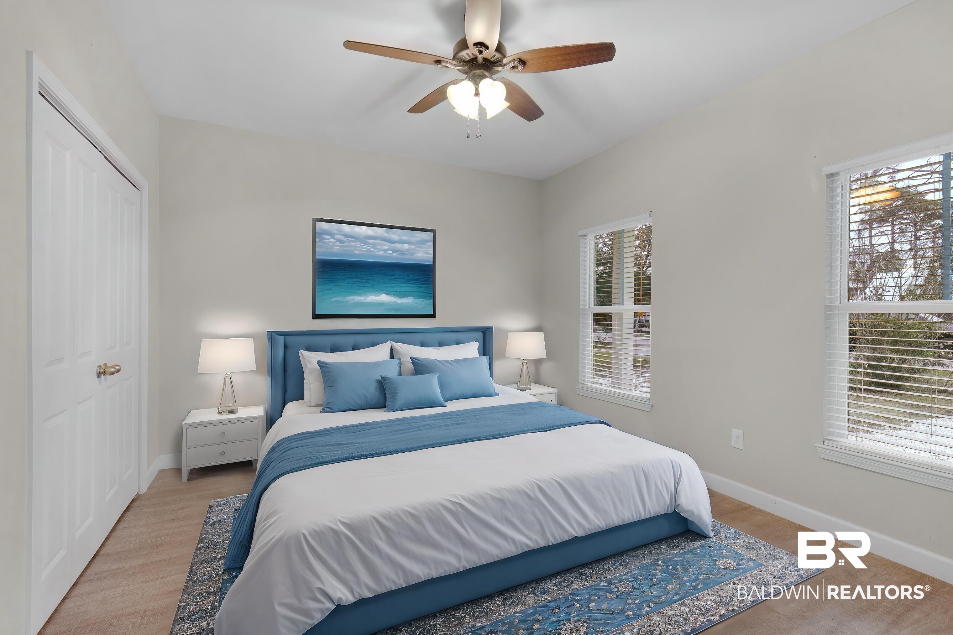 5625 Georgia Street Orange Beach, AL 36561 - Photo 18 of 30 Bedroom with ceiling fan, a closet, and light hardwood / wood-style floors