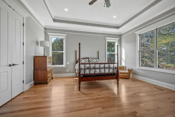 a bedroom with furniture and a window