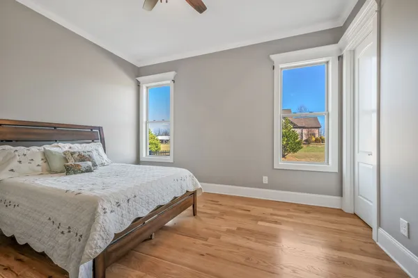a bedroom with a bed and window