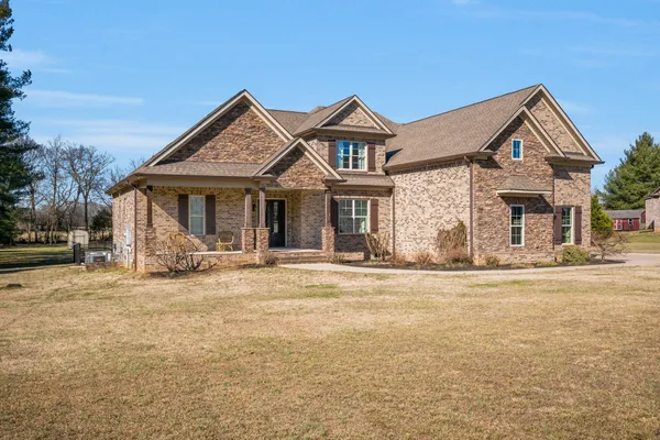 a front view of a house with a yard