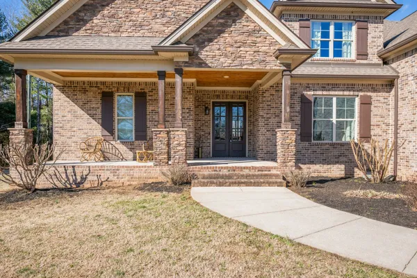 front view of a house with a rug