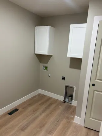 a room that has a rug and a window