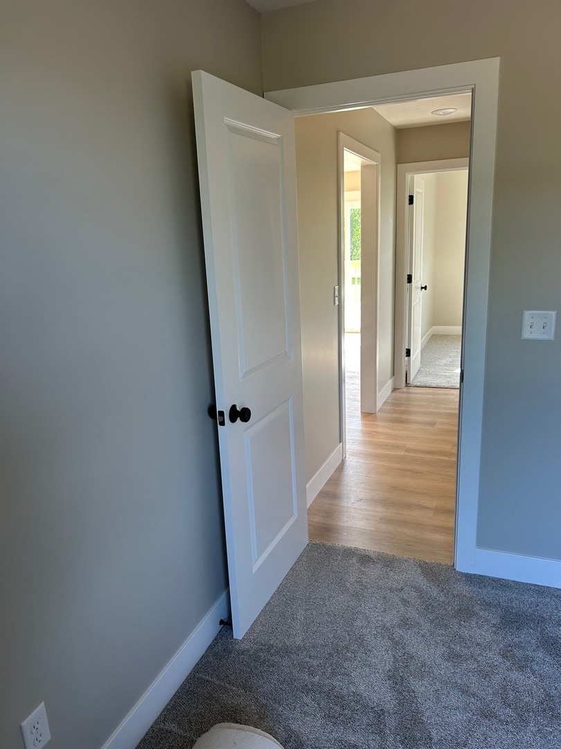 25179 North 2175 East Road Lexington, IL 61753 - Photo 12 of 23 a view of a hallway with wooden floor and closet