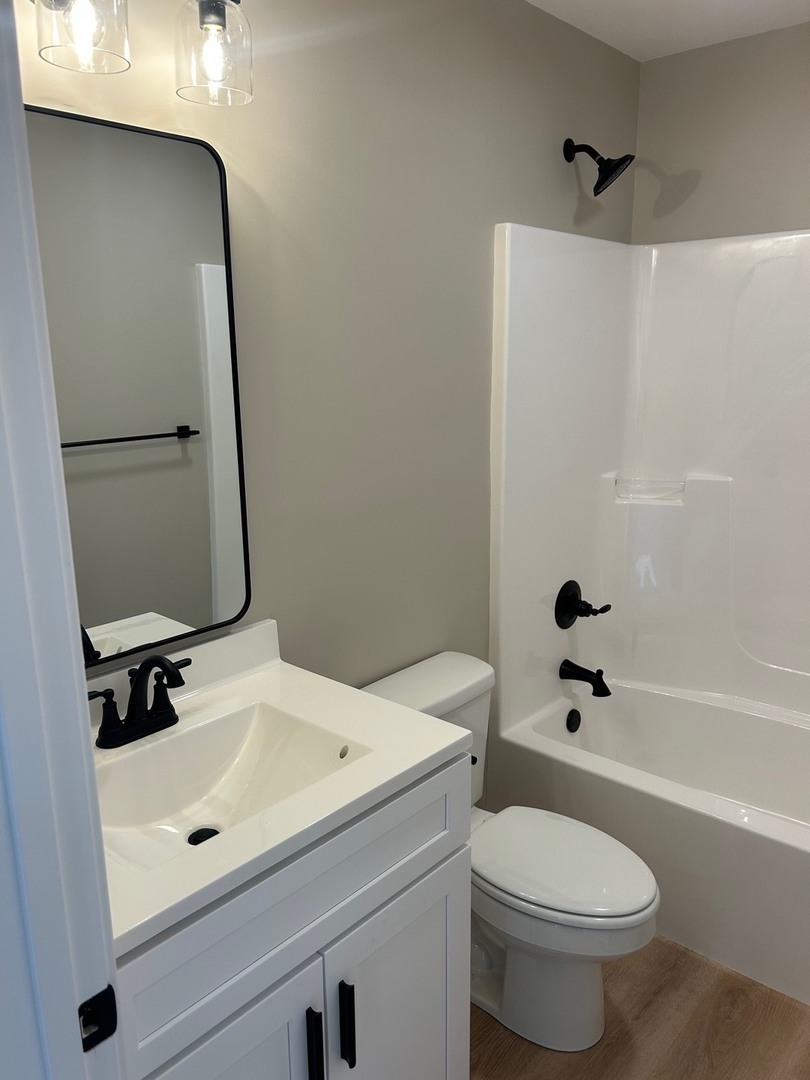 25179 North 2175 East Road Lexington, IL 61753 - Photo 13 of 23 a bathroom with a sink a toilet and shower
