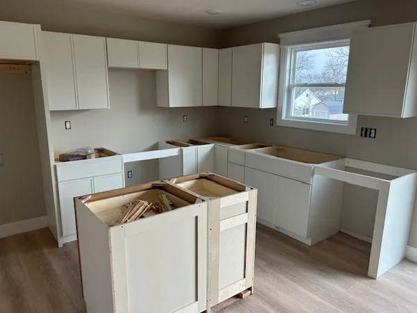 a utility room with dryer washer and a window