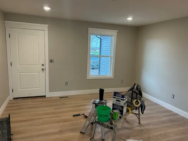 a view of room with wooden floor and chair