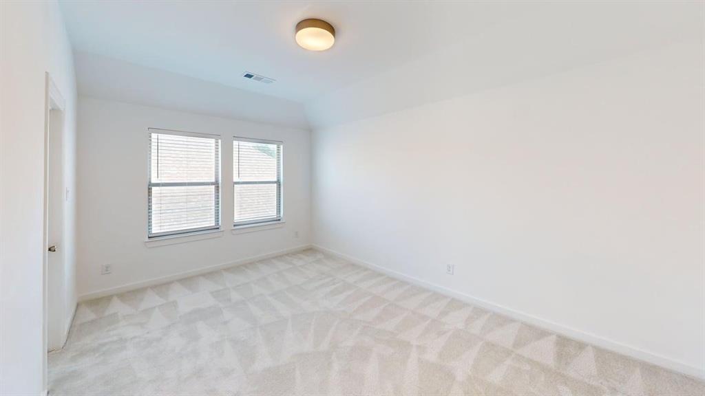 9628 Boulder Pt Road Oak Point, TX 75068 - Photo 10 of 35 Spacious room featuring light-toned patterned carpeting, neutral wall finishes, and a contemporary flush-mount ceiling light