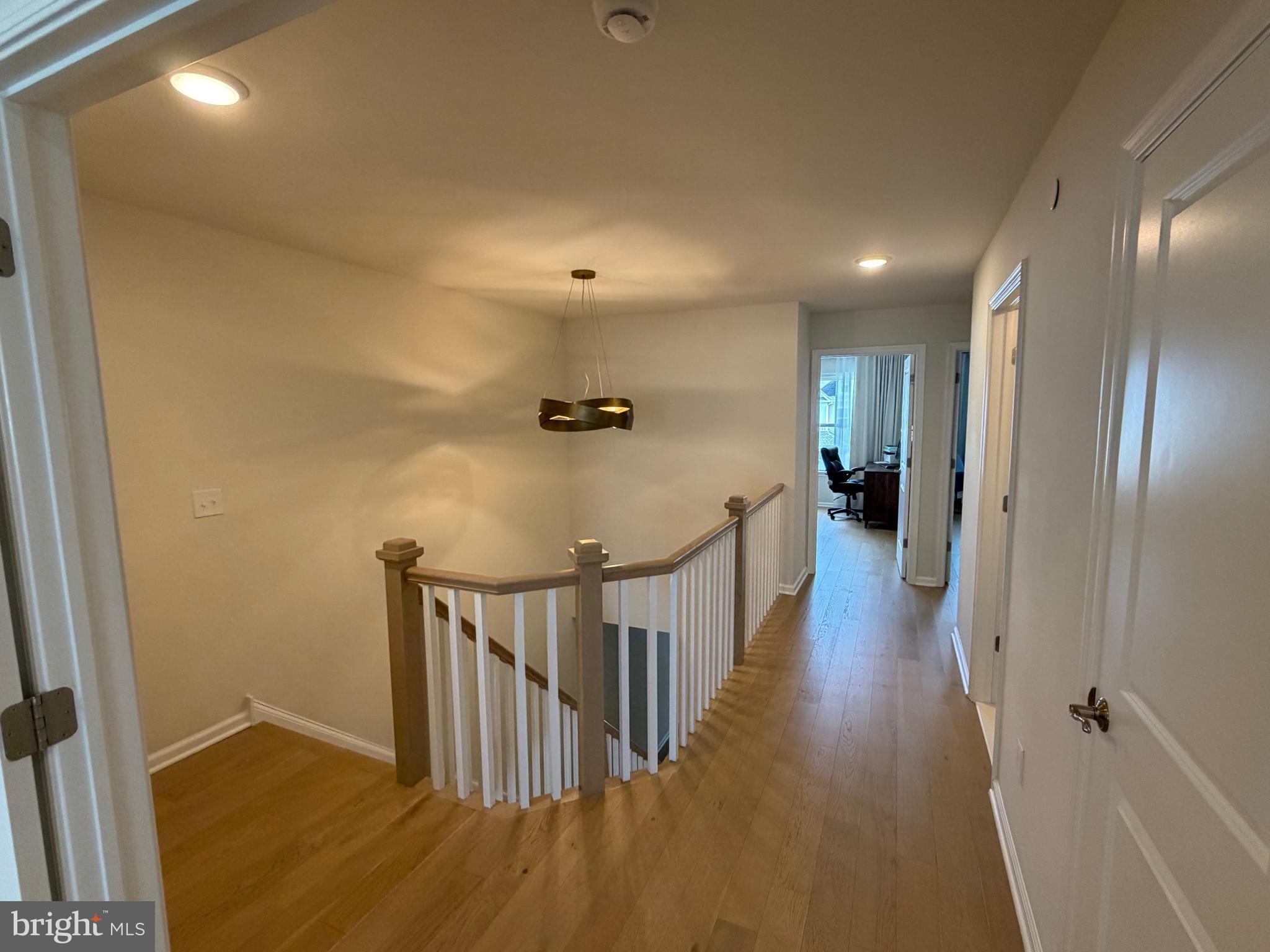 12 Spring Mill Drive Ivyland, PA 18974 - Photo 12 of 25 a view of a hallway with wooden floor