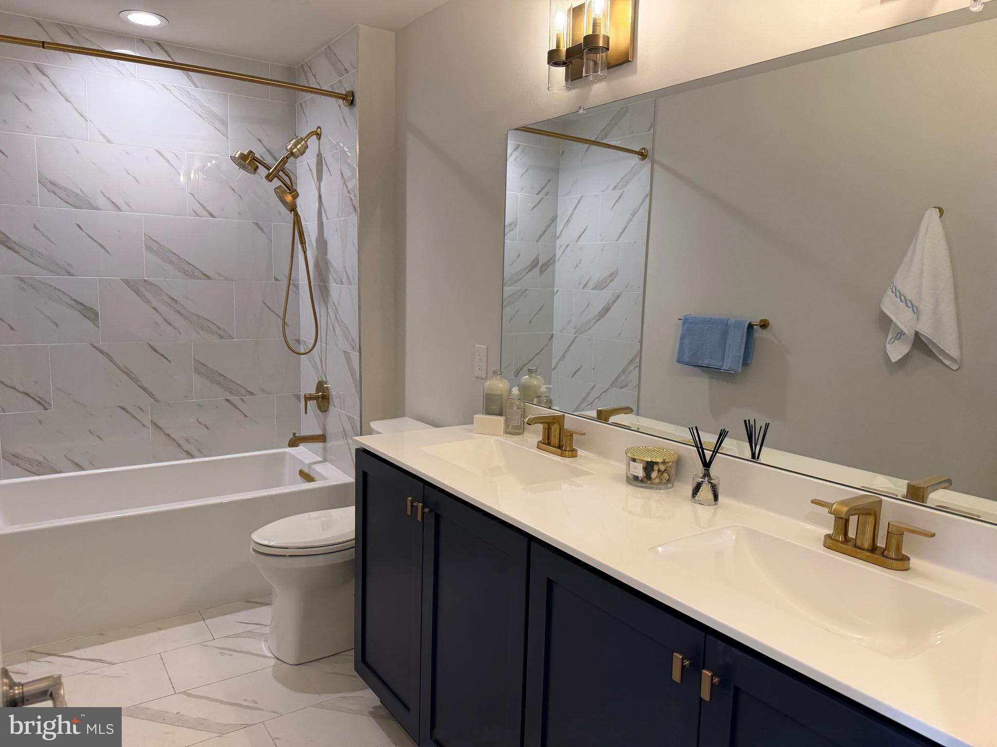 12 Spring Mill Drive Ivyland, PA 18974 - Photo 18 of 25 a bathroom with a double vanity sink toilet mirror and bathtub