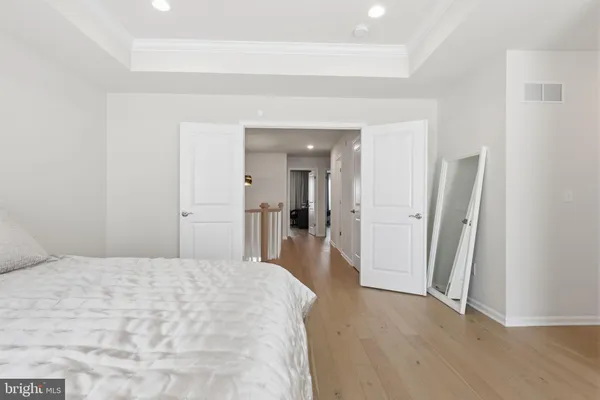 a bathroom with a granite countertop sink mirror and a toilet