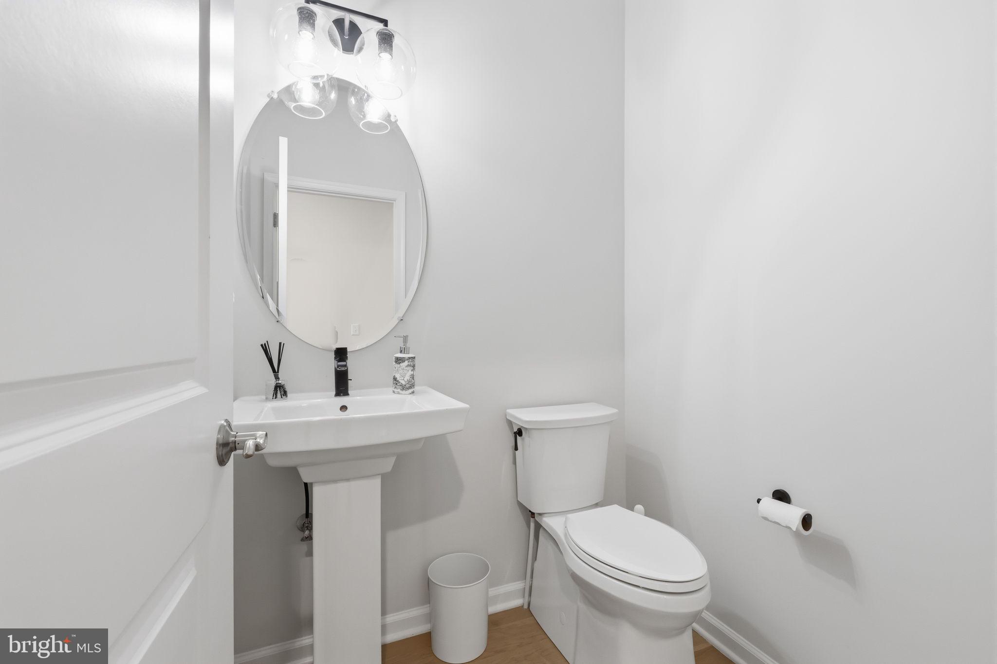 12 Spring Mill Drive Ivyland, PA 18974 - Photo 4 of 25 a bathroom with a toilet a sink and mirror