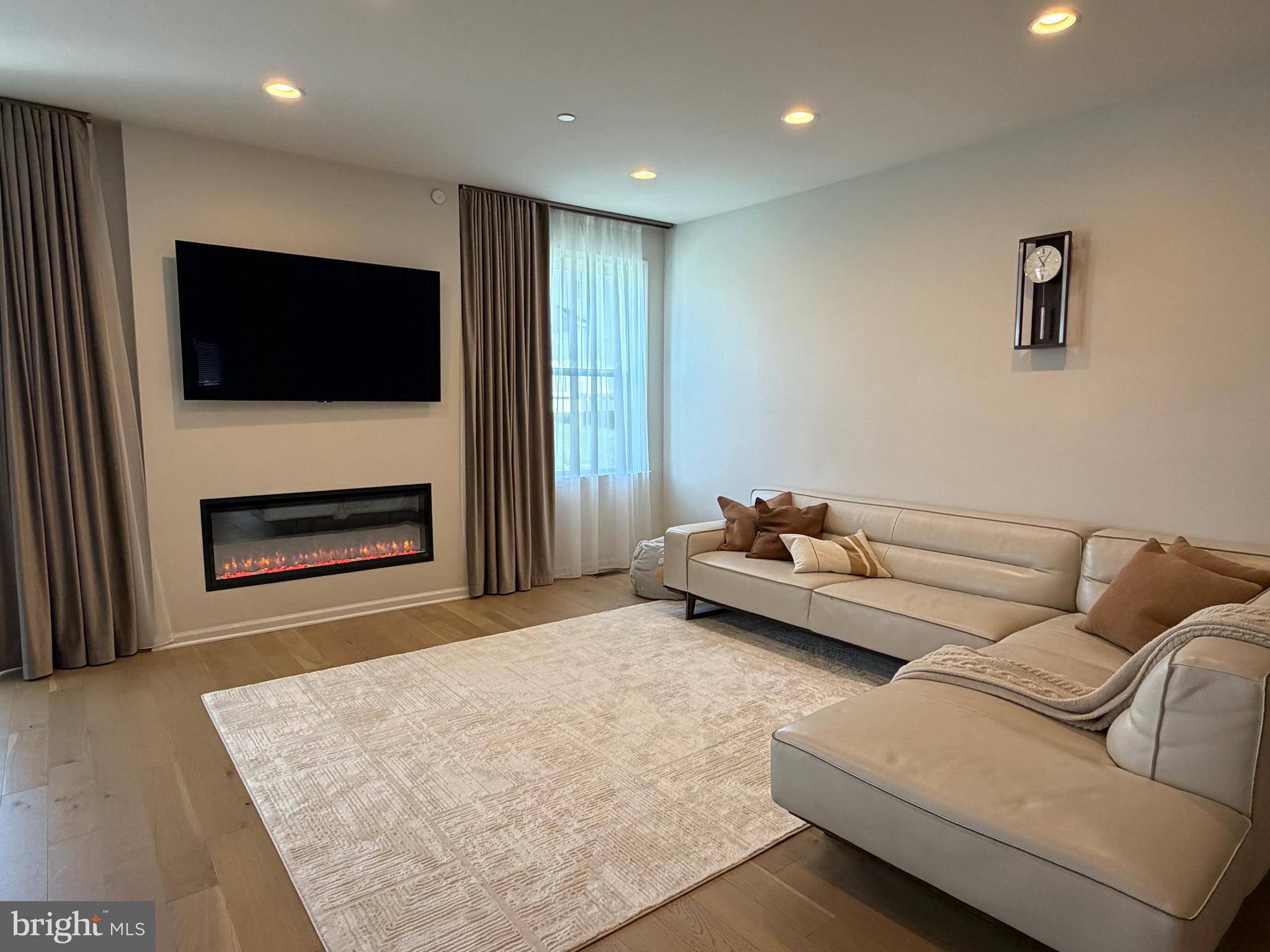12 Spring Mill Drive Ivyland, PA 18974 - Photo 8 of 25 a living room with furniture and a flat screen tv