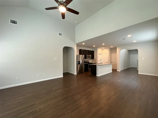a view of kitchen with cabinet and window