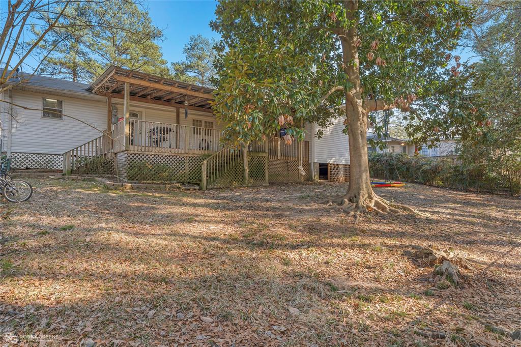 803 Drew Lane Minden, LA 71055 - Photo 27 of 33 a view of a house with a yard