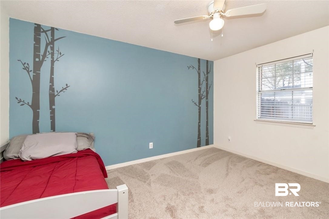 6601 Conde Court Mobile, AL 36695 - Photo 21 of 30 Bedroom featuring ceiling fan and carpet