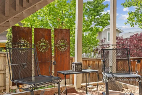 a view of balcony with wooden floor and outdoor seating