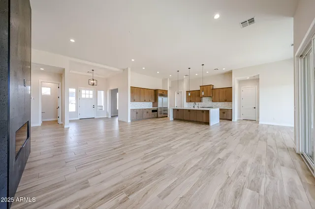 a stove top oven sitting inside of a kitchen