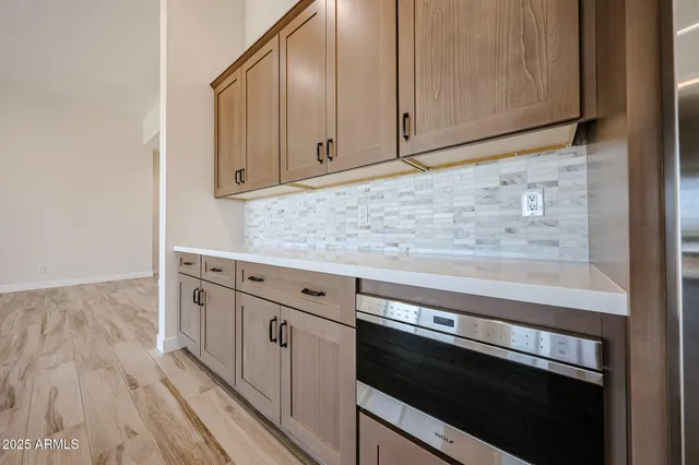 a bathroom with a double vanity sink mirror and a