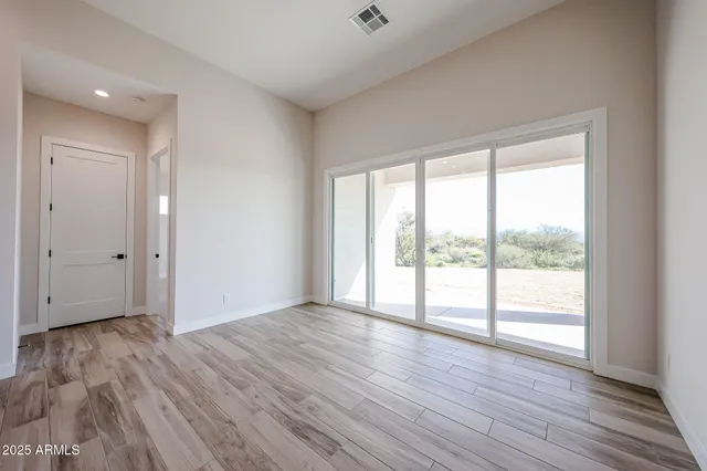 a bathroom with a double vanity sink mirror and next to a white cabinet