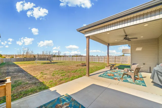 a view of swimming pool with seating space