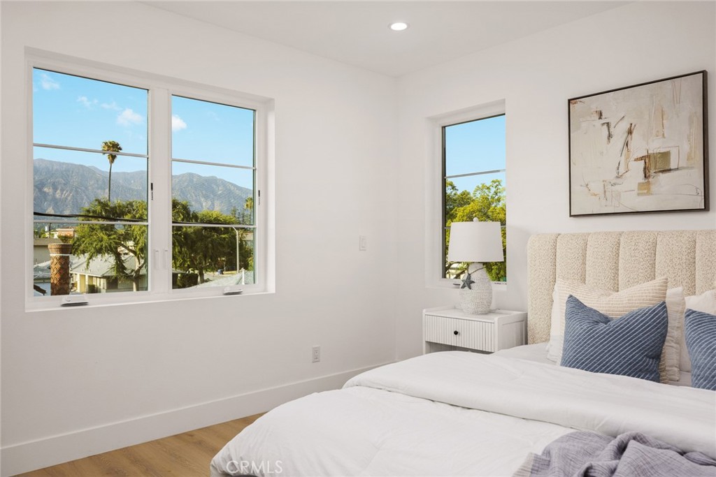 905 Sunset Boulevard, Unit A Arcadia, CA 91007 - Photo 16 of 35 a bedroom with a bed and a painting on the wall